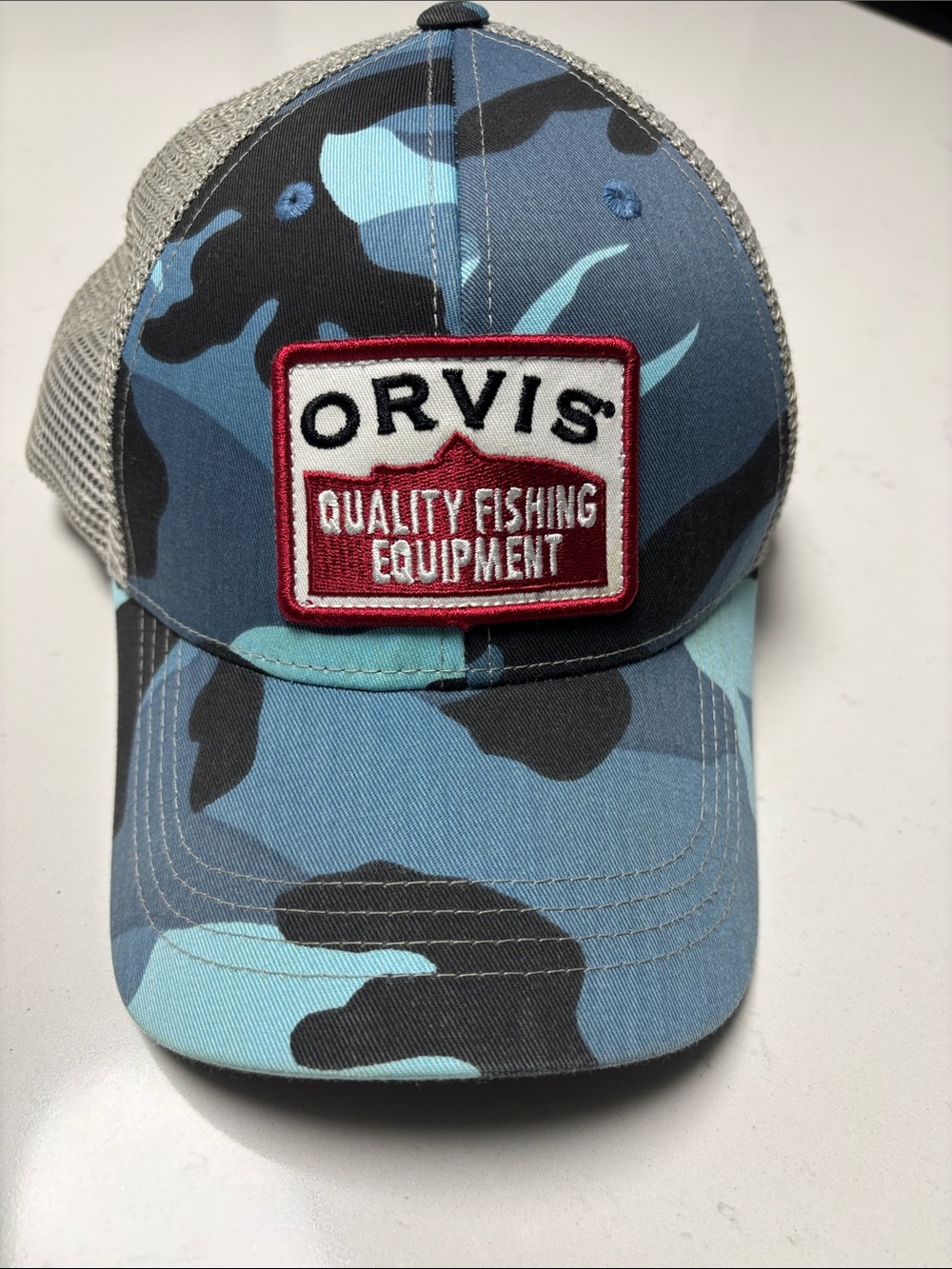 Orvis Blue and Black Camo Mesh Trucker Hat with Red Patch